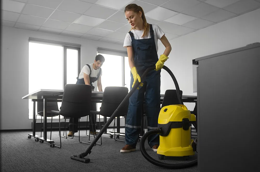 commercial-carpet-cleaning two cleaning workers working on cleaning in an office