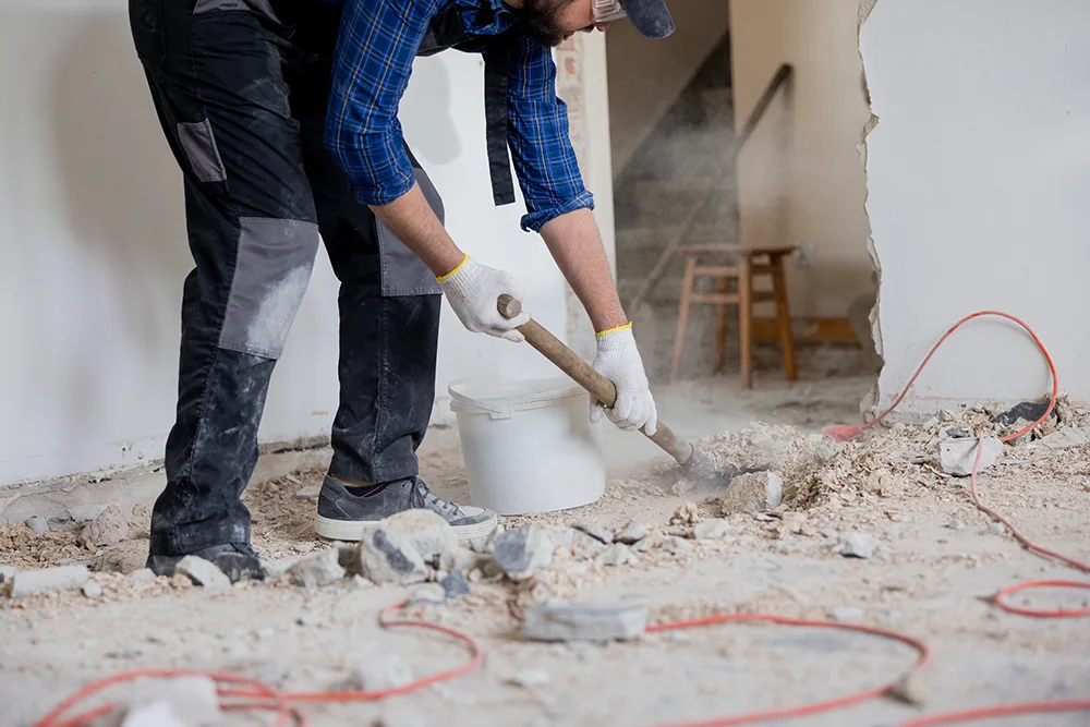 a person hauling debris from a home