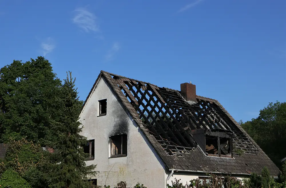 a houses with a burned roof