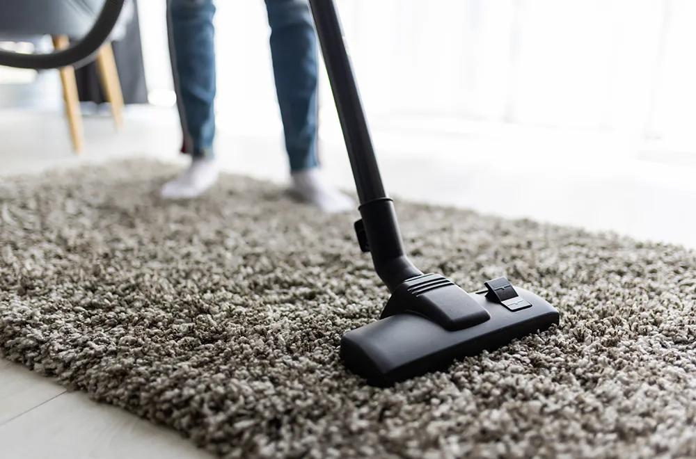 carpet-clean-brown a vacuum cleaner on a carpet