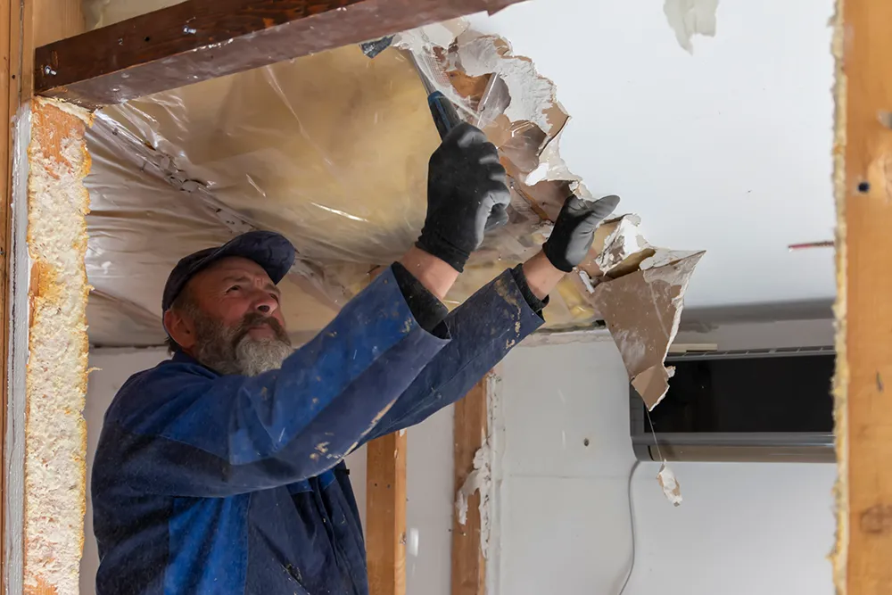 a man working on house restoration