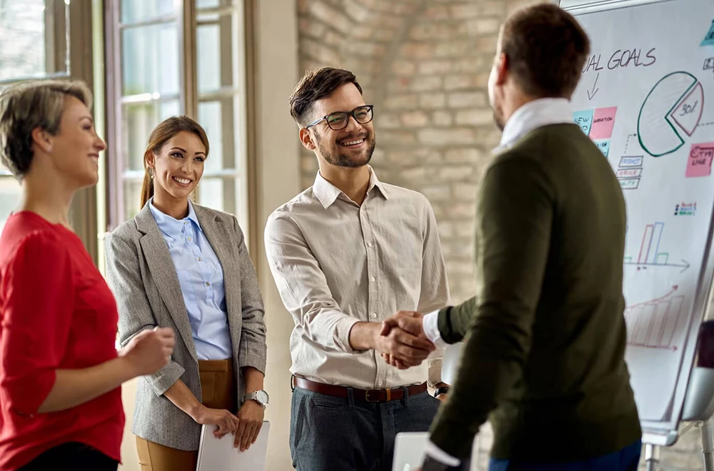 shaking hands to show a closed deal