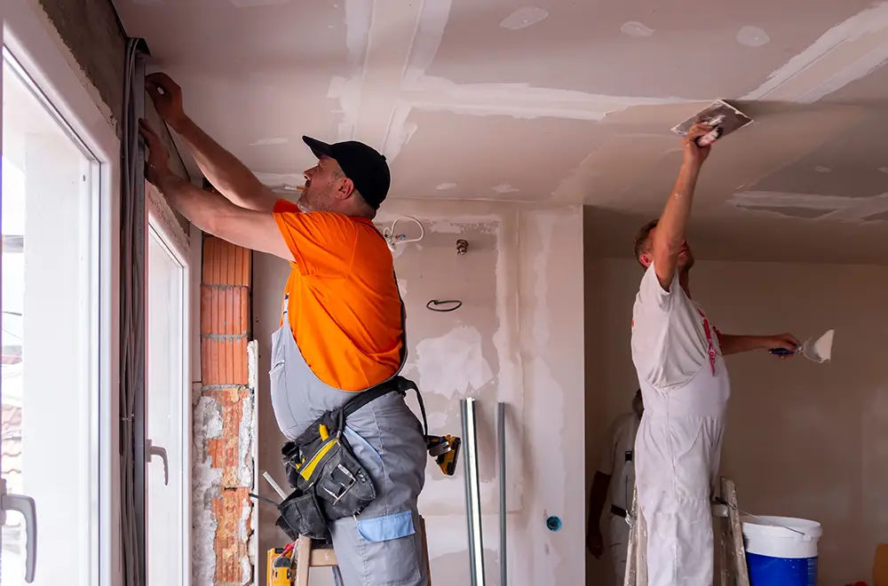 reliable-restoration two men working on ceiling restoration
