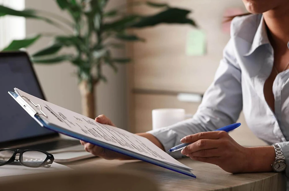 woman holding a document