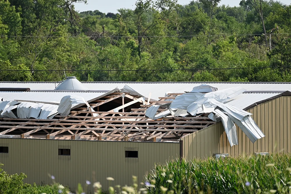 the roof of a building ripped off from a storm