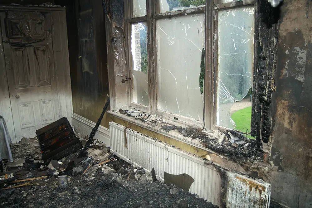 a burnt wall of a living room