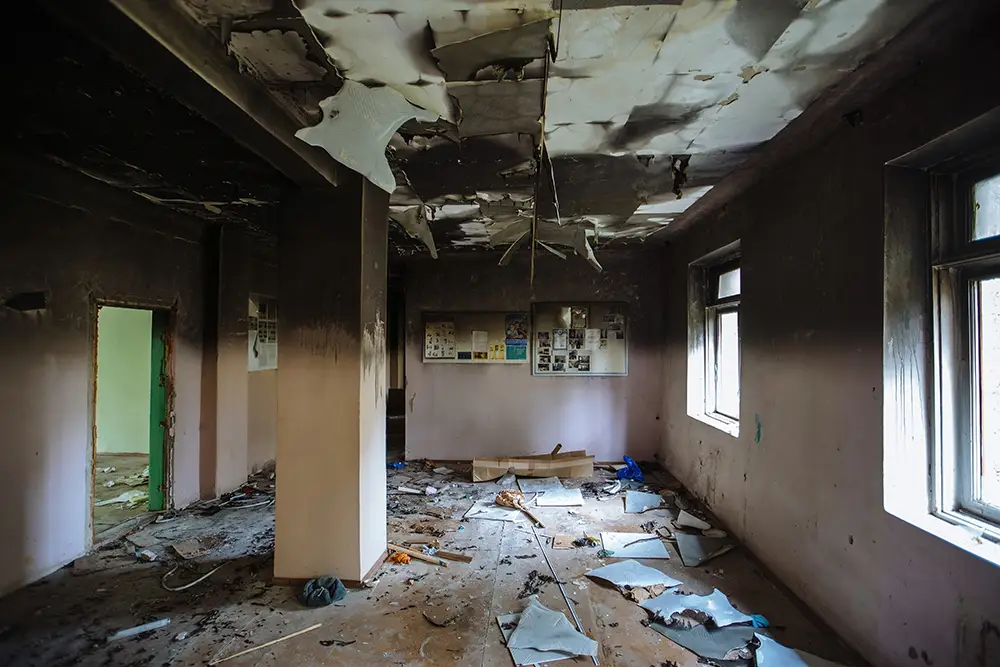 the roof of a building burnt from a fire