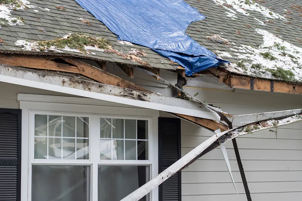a house with a damaged roof