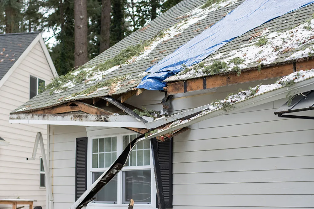 a house gutter damaged by a storm