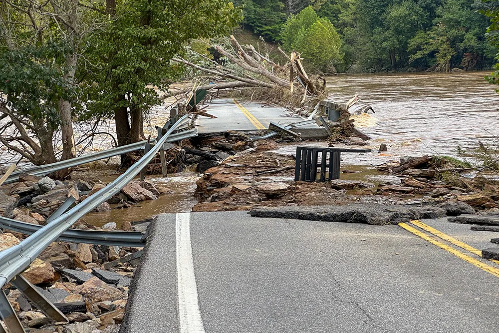 why-choose-us a damaged flooded road