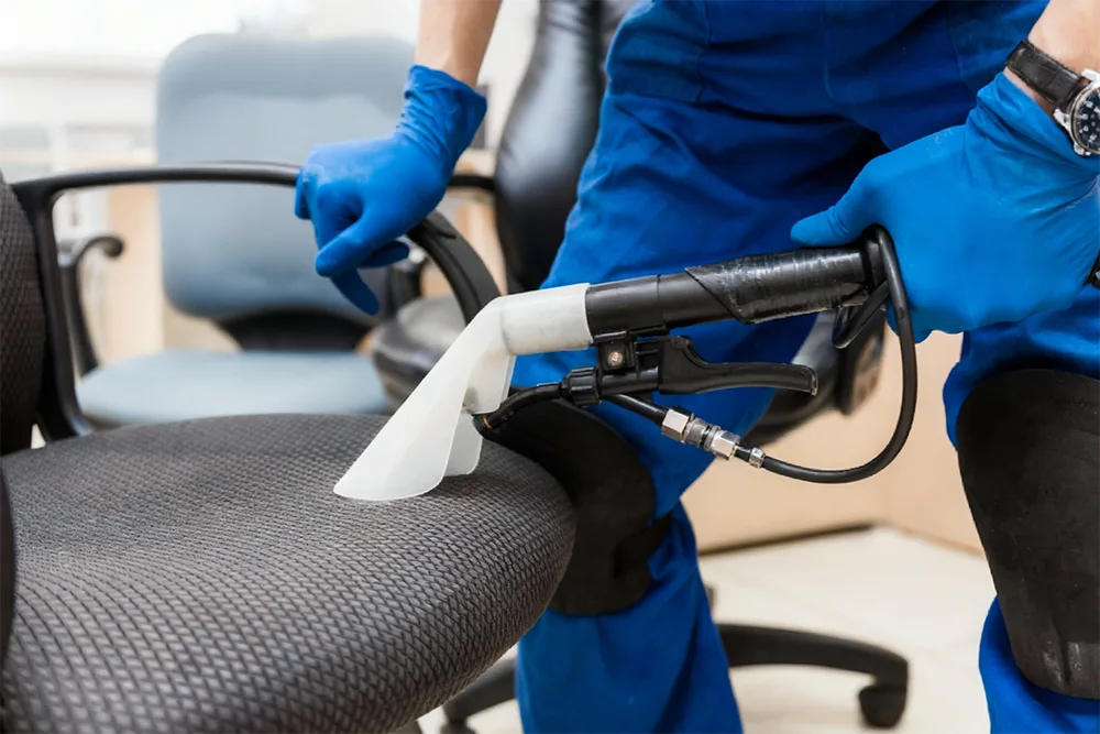 deep cleaning a chair with a water vaccum